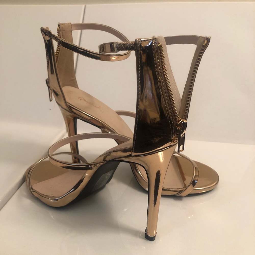 Gold open toe shoes
